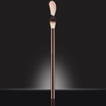 Rose gold makeup brush with soft gradient bristles and liquid highlight sample - Large Flame Highlighter Brush