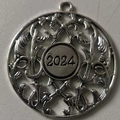 Silver metal Christmas snowman ornament with 2024 engraving and scrollwork detail - 2024 Antique Silver / Antique Silver