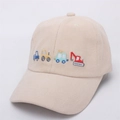 Close-up of beige kids baseball cap with colorful cartoon vehicle embroidery details - Kids Size / Construction Vehicles Embroidery / Beige