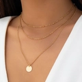 Detailed close-up of a three-layer gold necklace set featuring a round coin pendant charm - Gold-Tone Round Pendant Triple-Layer Style (03 Gold-Tone)