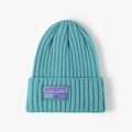 Fashionable turquoise knit beanie with authentic fabric patch for winter warmth - One Size / Deep Lake Blue