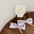 Detalle de gomas de pelo con lazos de cuero sintético plateado y seda rosa en tarjeta - 10 Par de Coleteros