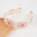 Pink daisy crochet headband for women with handmade knit floral patterns on wood - Light Pink