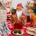 Detailed view of a 12-inch standing Santa Claus figurine with a red plaid coat and gift sack - Lantern Style / 30cm