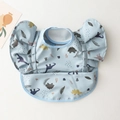 Waterproof baby bib with blue dinosaur print, flutter sleeves and food catcher pocket - Wings - Blue Dinosaur / One Size