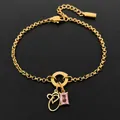 14K gold plated stainless steel bracelet featuring initial O charm and pink zircon pendant - Letter O