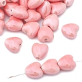 Pink heart-shaped ceramic beads for DIY jewelry with glossy glazed finish and center hole - Pink