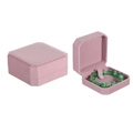 Macro detail of an octagonal pink velvet jewelry box showing interior and exterior - Pink