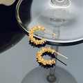 Close-up of gold C-shaped earrings with unique irregular crushed metal texture - 14K Gold Irregular Textured Stud Earrings (A-436)