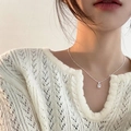 Close-up of minimalist silver necklace with rectangular sapphire pendant on a model - Rectangular Clear Zirconia (XL2195)