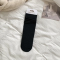 Solid black slouch socks made of breathable cotton with minimalist ribbed design - Black