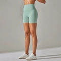 High-waisted mint green yoga shorts for women featuring nude feel and peach lift - Aqua Green