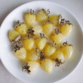 Detailed view of yellow resin strawberry charms with gold loops on a white ceramic plate - 5# Simulation Yellow