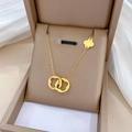 Detail of gold titanium steel necklace with double interlocking rings and clover charm - Double Ring Clover Pendant (N234) / Gold