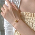 Elegant gold heart pendant necklace for women with delicate beaded chain on model - [XKB0022] Heart Bracelet Gold