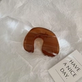 Minimalist amber brown large U-shaped hair claw clip in translucent resin finish - Coffee
