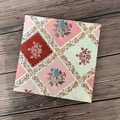 Pastel floral patchwork pattern disposable napkin on a vintage wooden background - Multicolor Flowers
