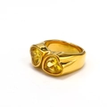 Detail view of gold wide band ring featuring two sparkling yellow heart shaped gemstones - Gold (Yellow/Yellow Heart)