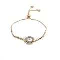 Detailed view of the Evil Eye charm on a gold-plated adjustable bracelet with blue stones - Gold Bead Chain