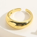Polished gold adjustable open ring with a smooth mirror finish on a white pedestal - Glossy
