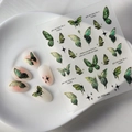 Detailed view of 5D green butterfly nail stickers with embossed textures and stars - Forest Butterfly (FEB-440)