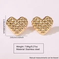 Detailed view of heart-shaped gold stainless steel earrings with quilted texture and size - Quilted Texture Heart