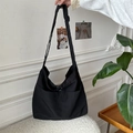 Large black nylon crossbody bag with drawstring detail and wide adjustable strap - Black