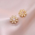 Close-up of gold flower earrings with pink zircons on elegant pink silk background - Pink Earrings / Pink