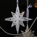 Sparkling white 3D star ornament with frosted crystal texture and purple ribbon - Sparkling White Hollow Explosion Star 13CM