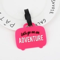 Pink suitcase-shaped silicone luggage tag with Let's go on an ADVENTURE text - Luggage