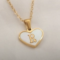 Elegant gold heart pendant necklace with white shell inlay and letter R on silk - Letter R