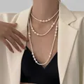 Detail of layered 14K gold plated pearl necklace showing triple strands and elegant drape - 35# White 4-8mm Pearl Necklace