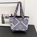 Ethnic style tote bag with colorful geometric knitting and black leather base detail - Blue