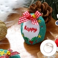 Green knitted Christmas brooch with happy embroidery and festive bell decorations - Gift Box - Brooch Style