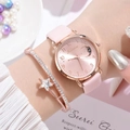 Close-up of pink star and moon quartz watch with matching rose gold starry bracelet - Watch + Bracelet / Pink