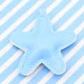 Light blue faux leather star keychain with white stitching on a striped background - Light Blue
