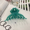 Detail of a large green flower hair claw clip placed on a white magazine background - Approx 11cm / Turquoise Green