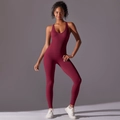 Close-up of the burgundy one-piece yoga jumpsuit showing seamless fabric and back design - S / Burgundy