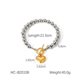 Detalle de pulsera de cuentas con cierre en T dorado y medidas del colgante de corazón - Cuentas de Dos Tonos con Corazón Dorado (HC-B20108)