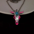 Detail of silver bull skull pendant with blue turquoise stone and pink enamel accents - Rose Red Light