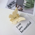 Elegant butterfly hair claw clip in cream white marble acetate with metallic spring - Apricot