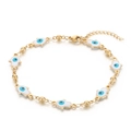 Golden Hamsa Hand bracelet with white enamel Evil Eye charms on a clean white background - White Bracelet (KB169293-MW)