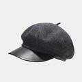 Detailed close-up of dark grey wool newsboy cap with black leather brim and vintage texture - One Size / Marl Grey