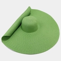 Detail of the oversized straw sun hat brim in vibrant grass green woven texture - One Size / Green