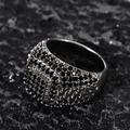 Macro shot of men's wide silver ring with micro-paved black zircons on rock background - US-7 / Platinum-Black Zirconia