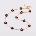 Minimalist gold daisy necklace with deep red flower beads on a white background - Dark Red