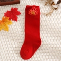 Detail of red baby festive long socks featuring a Fu bag accessory and soft cotton knit - Red-Fortune Character / S (0-1 Years)
