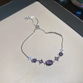 Macro view of purple zircon flower bracelet with S925 silver adjustable sliding clasp - Purple Oval / Silver
