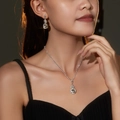Silver water drop jewelry set with round rhinestones on model, necklace and earrings - Round Cut Main Stone Luxury Set (DTN10026375S)
