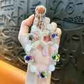 Luminous balloon dog beaded keychain in iridescent finish for bags and phones - White